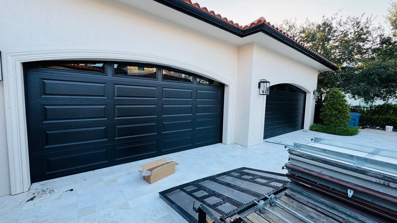 Modern black garage doors on installation day